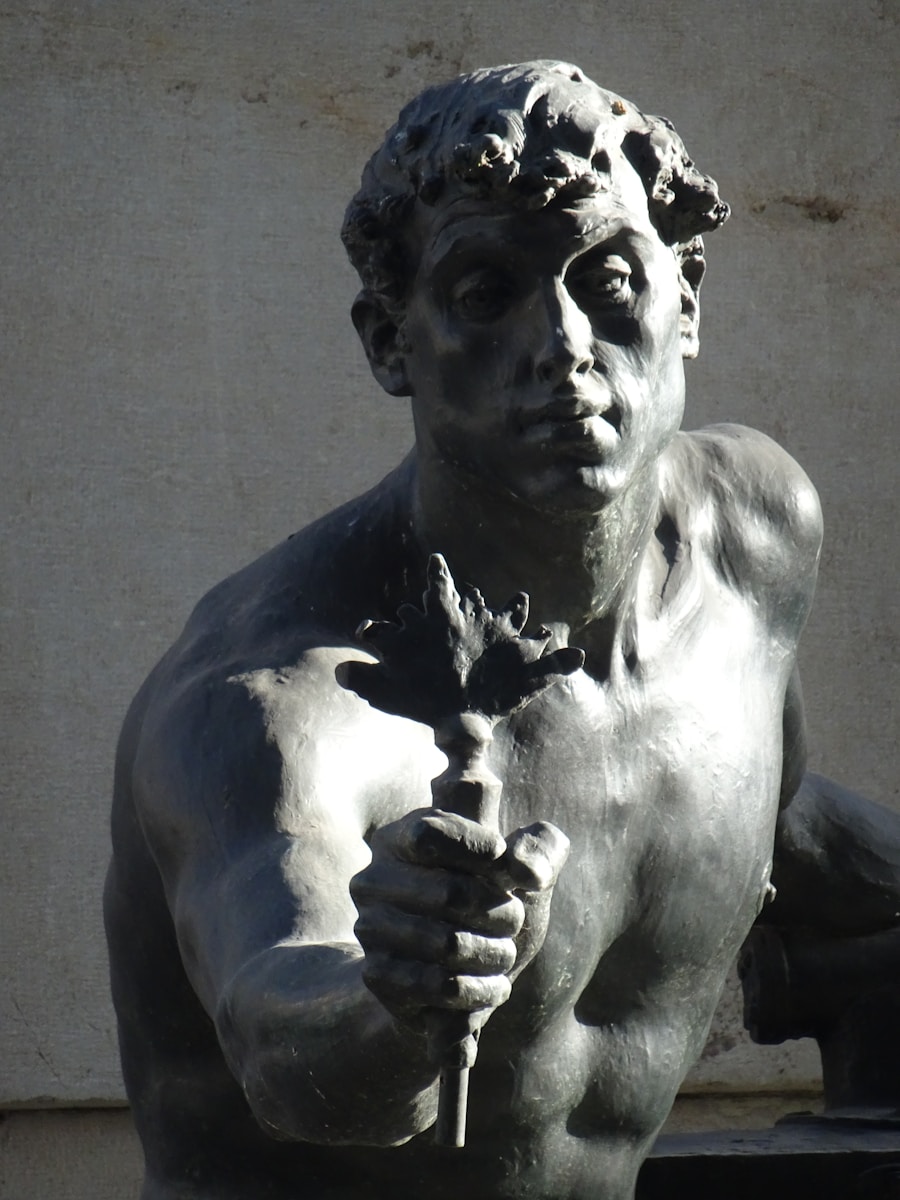 A statue of a man holding a flower
